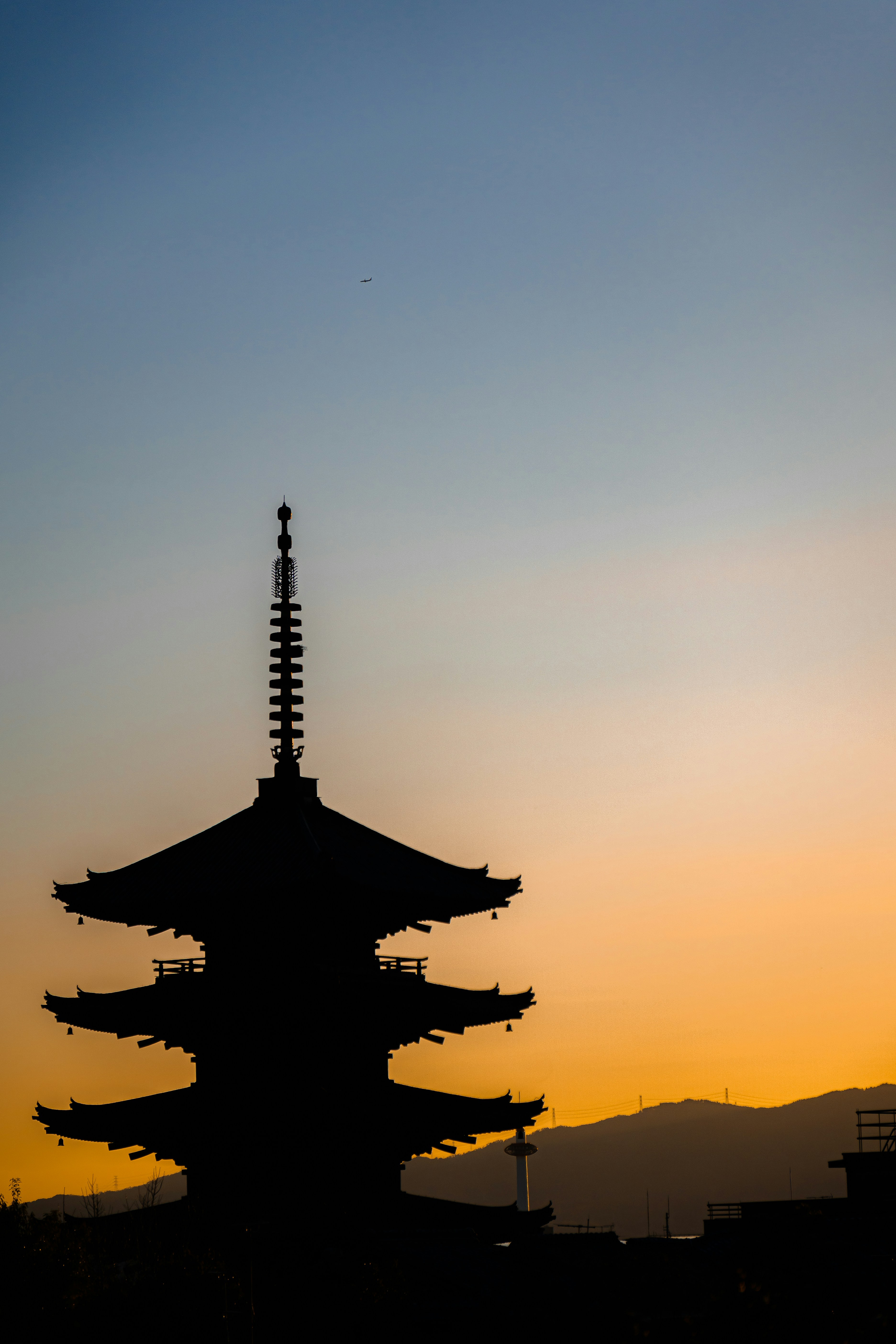 a tall building with a sky in the background