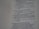 The image contains a close-up view of a page from a book with text focused on religious or philosophical content discussing gods and idols. The text appears on the right side of the page, with a margin on the left showing horizontal dotted lines.