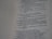 The image contains a close-up view of a page from a book with text focused on religious or philosophical content discussing gods and idols. The text appears on the right side of the page, with a margin on the left showing horizontal dotted lines.