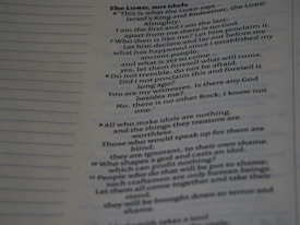 A page from a book featuring text in a structured format, possibly from a religious or philosophical context. The text includes headings and numbered passages, with a combination of bold and regular typeset.