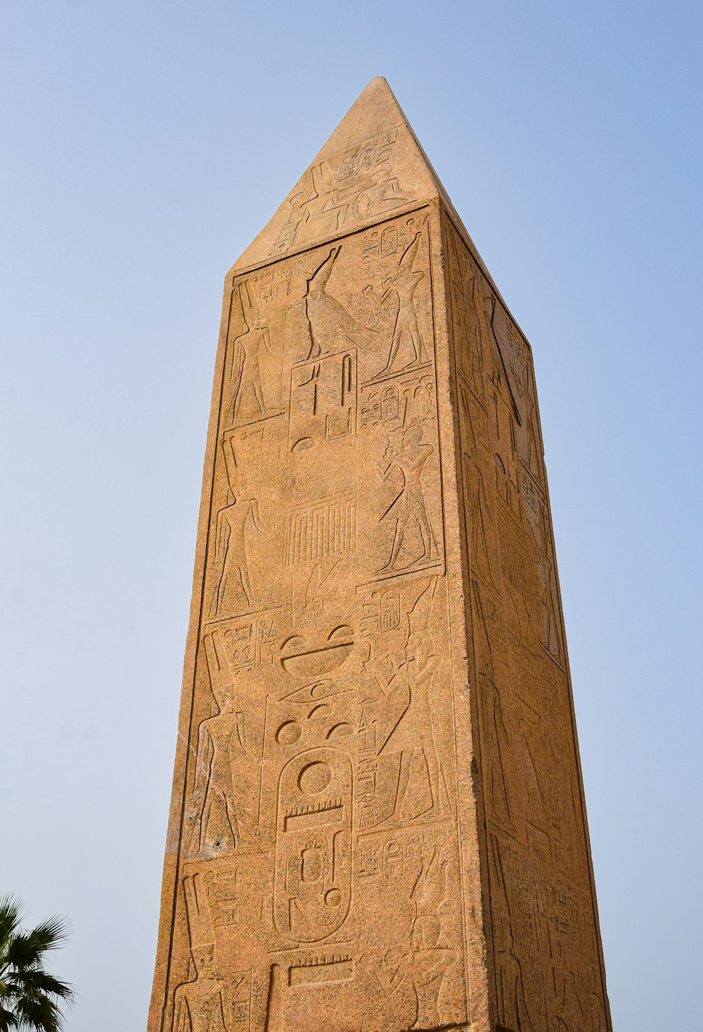 a tall stone obelisk with egyptian writing on it