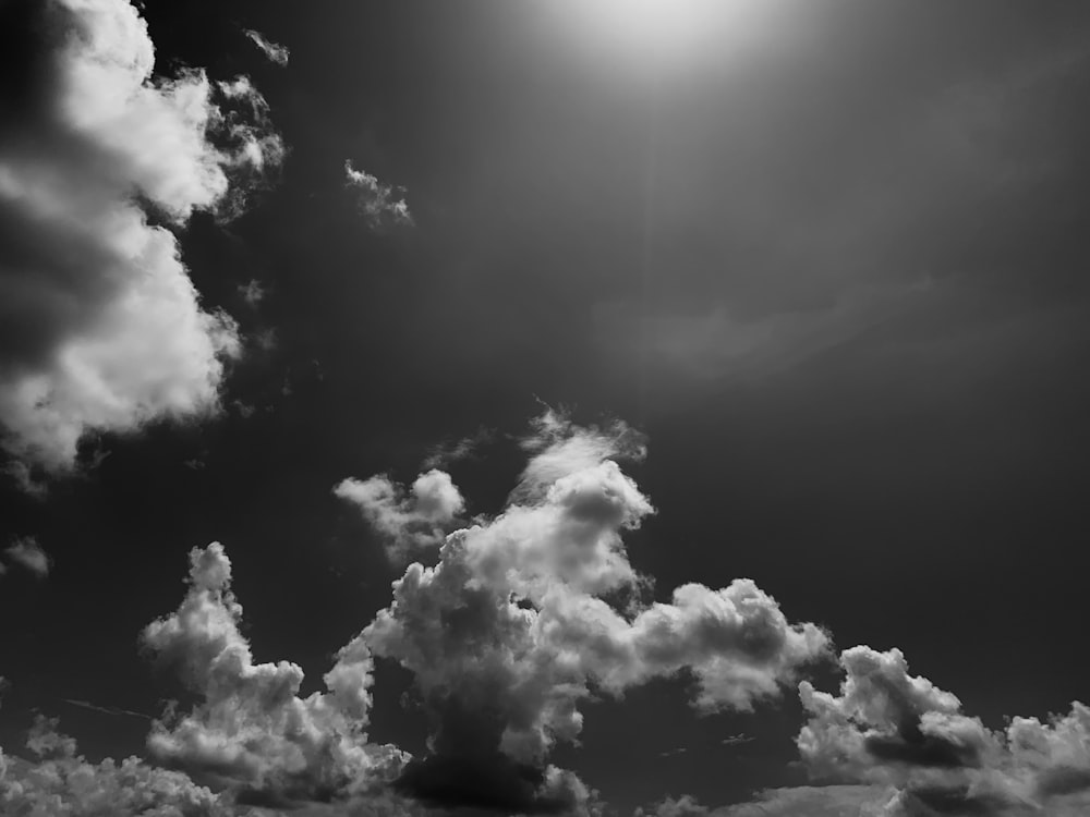 a black and white photo of clouds in the sky