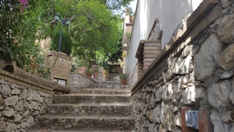 Rustic garden design with natural stone pathways and warm lighting at dusk.