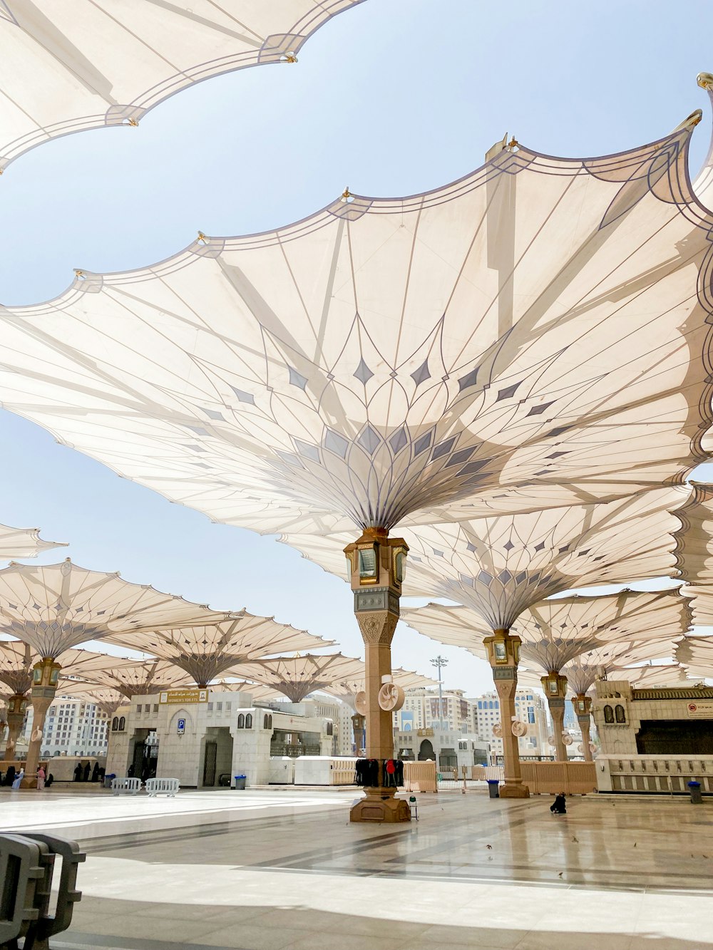 a bunch of umbrellas that are in a building