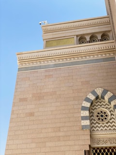 a tall building with a clock on the front of it