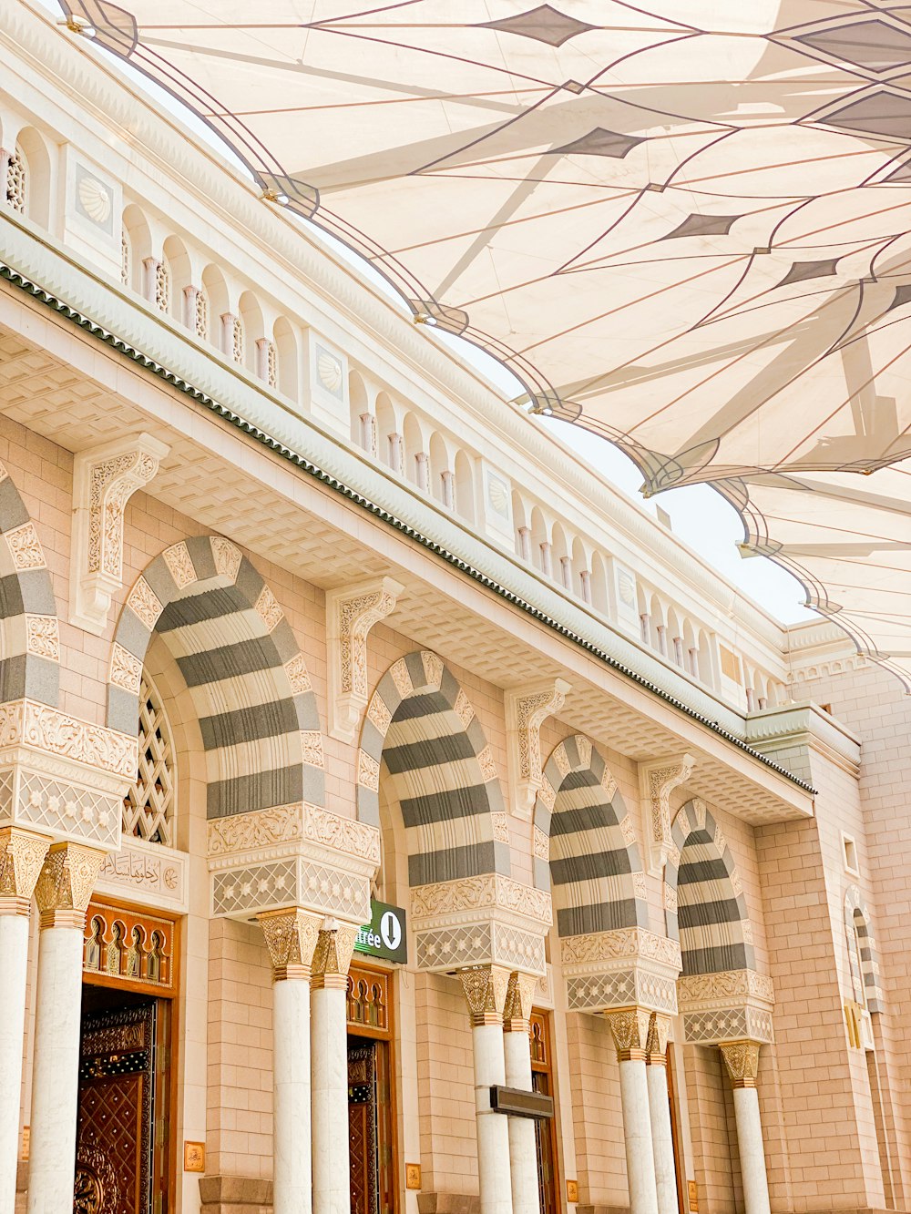 a large building with columns and a clock