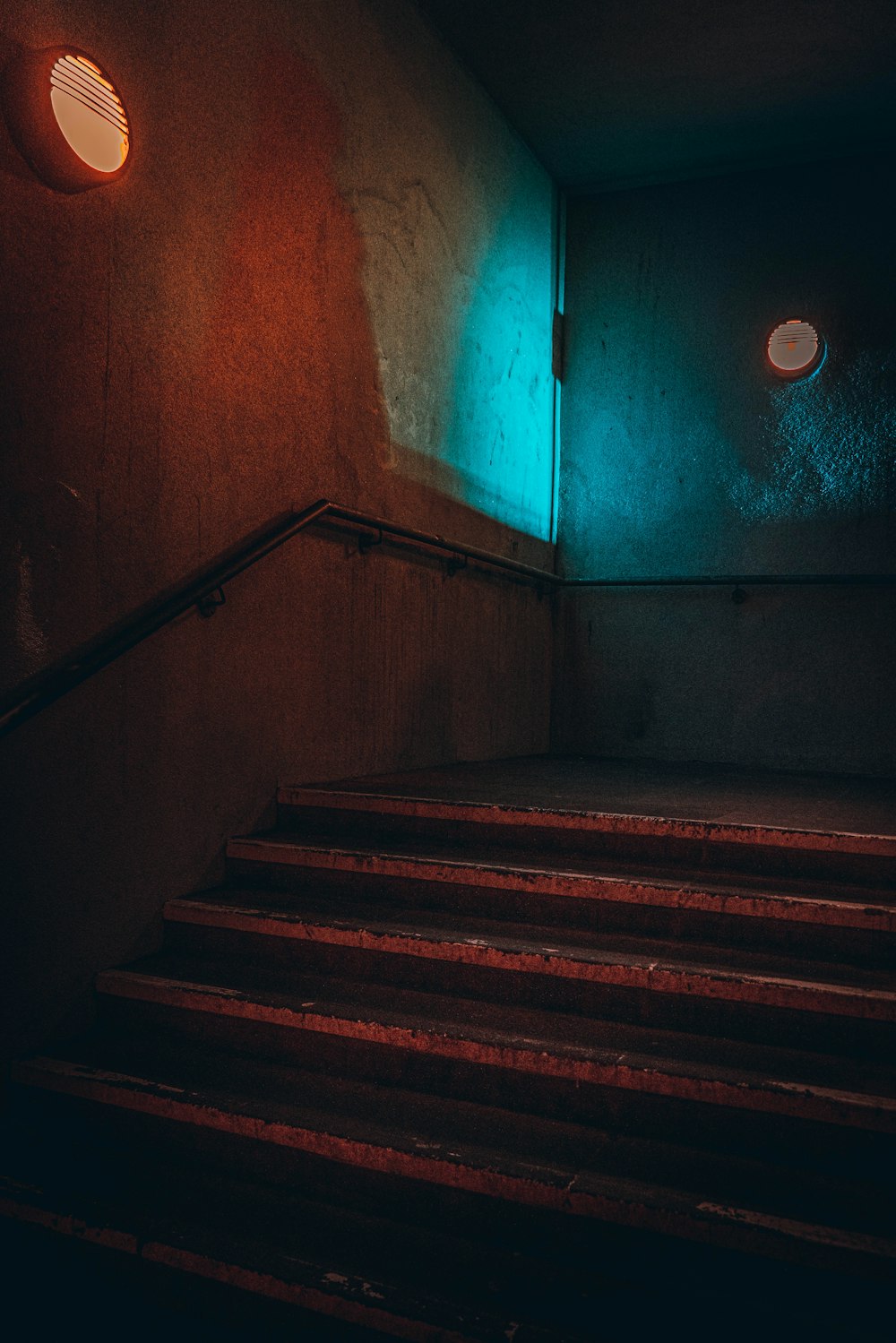 a set of stairs leading up to a green light