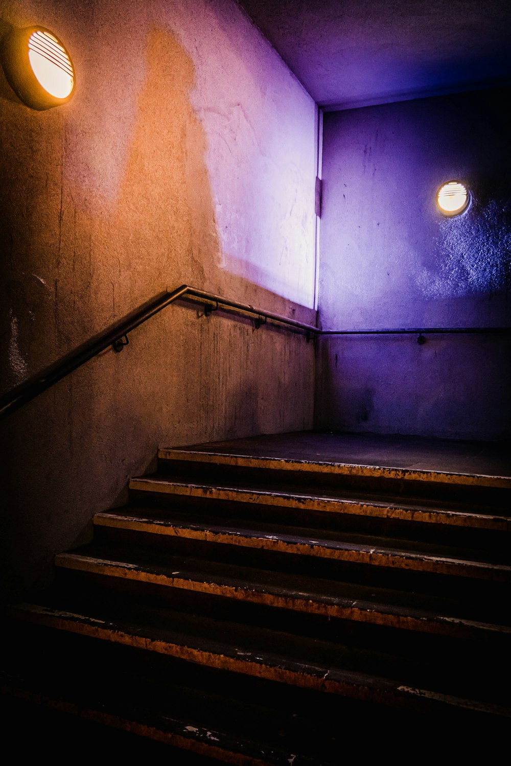 a set of stairs leading up to a bright light