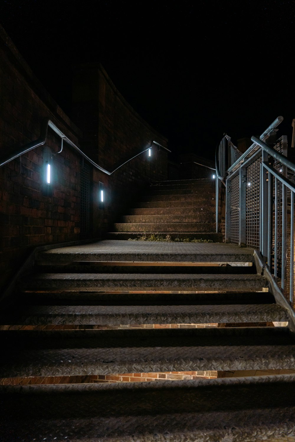 a set of stairs lit up at night