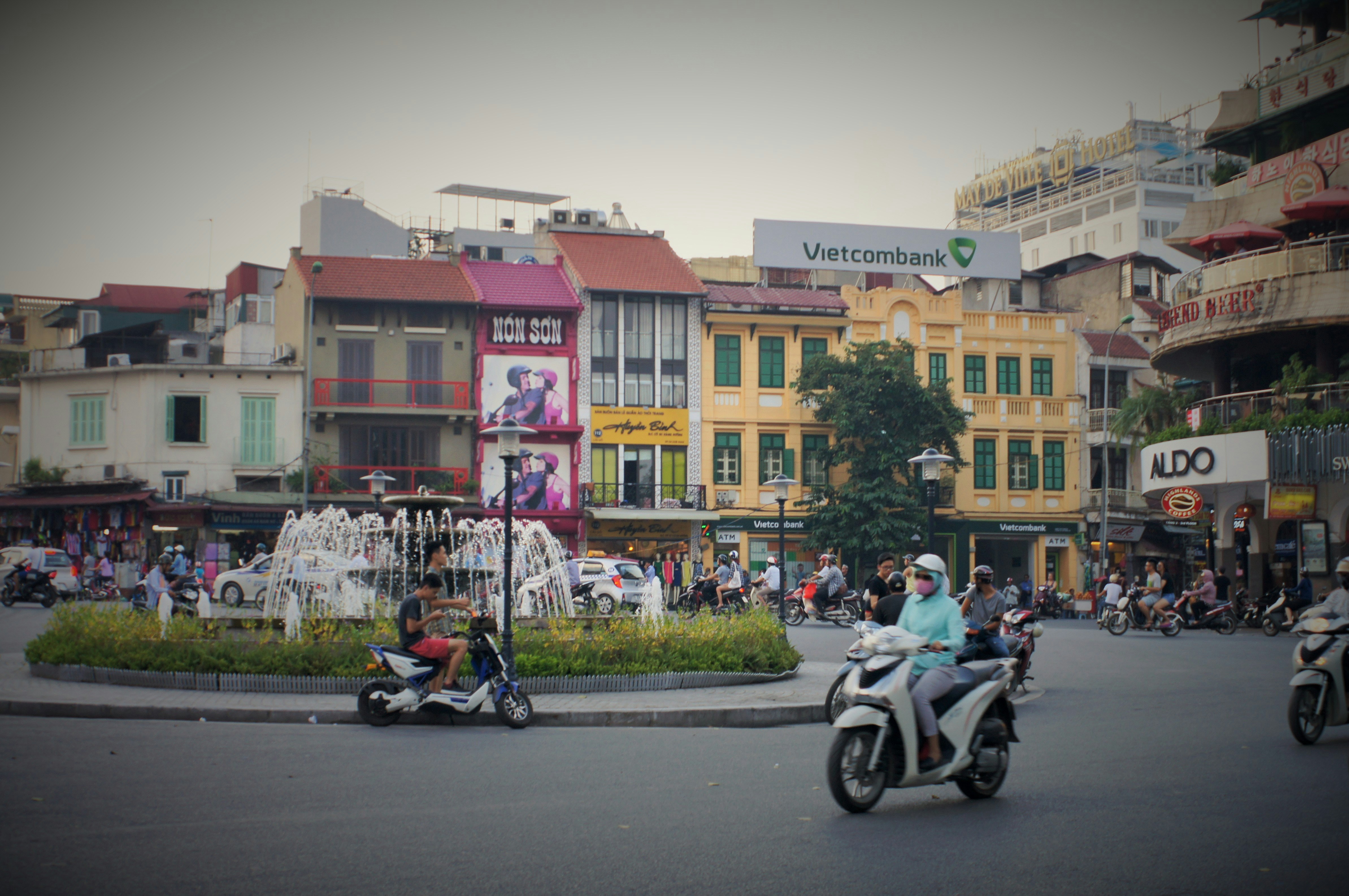 Group of people riding scooters in Vietnam