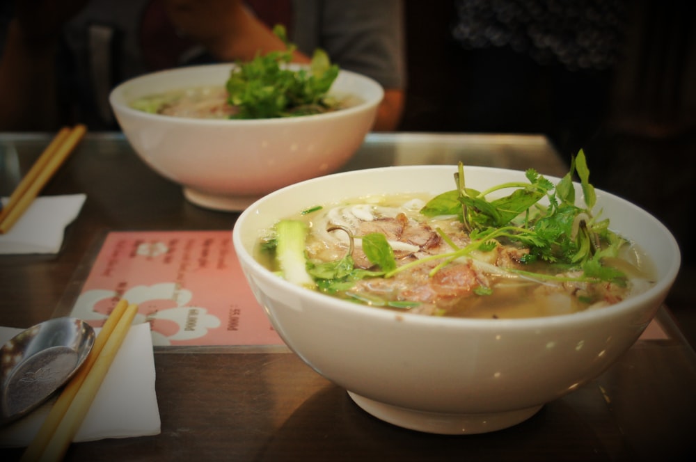 a couple of bowls of food on a table