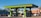 A vibrant green gas station with multiple fuel pumps is situated in a bright area surrounded by motorcycles, a van, and a distinct architectural building with intricate patterns. There are palm trees and flags in the background, adding to the lively and colorful ambiance.