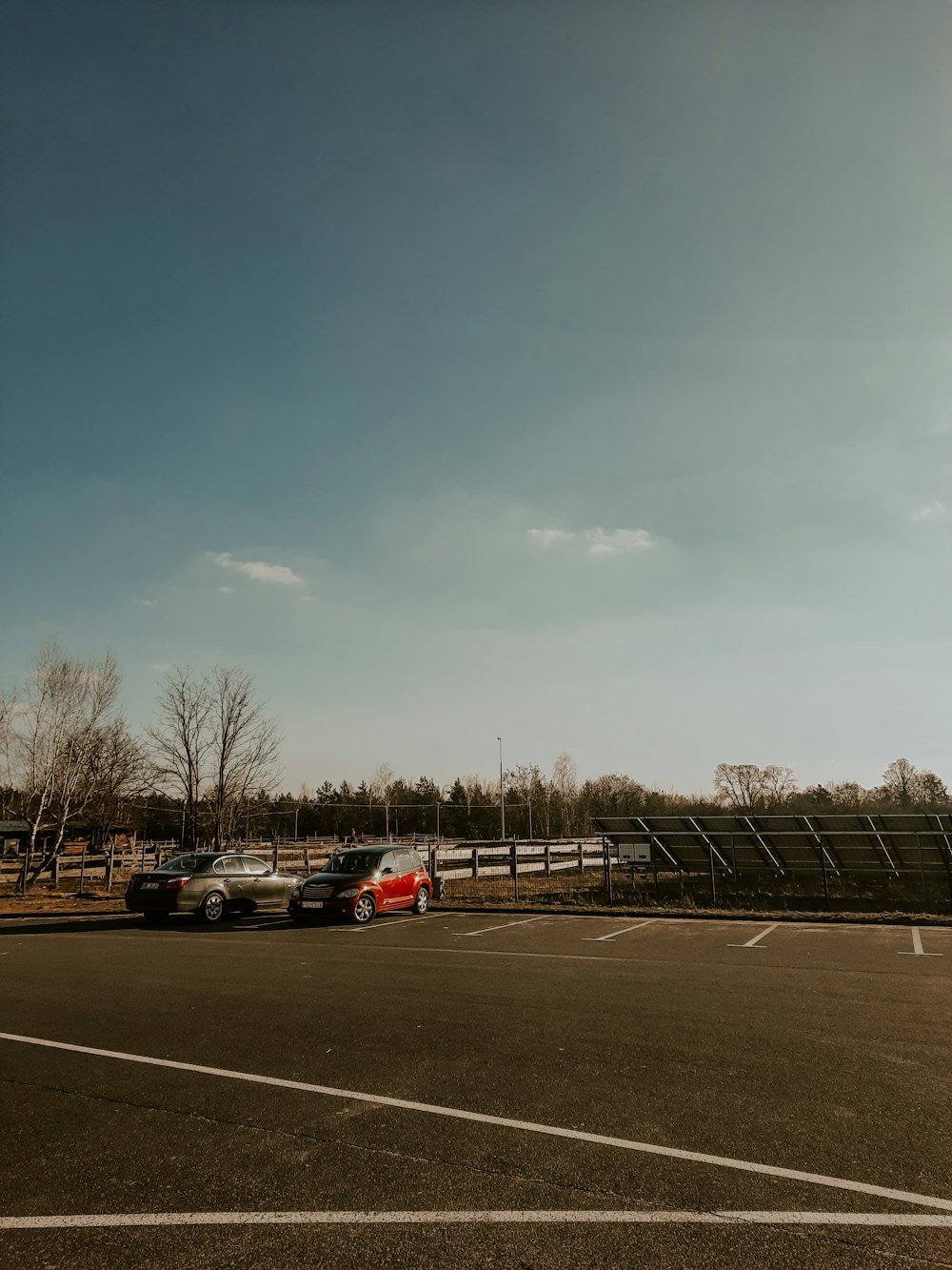 a parking lot with several cars parked in it