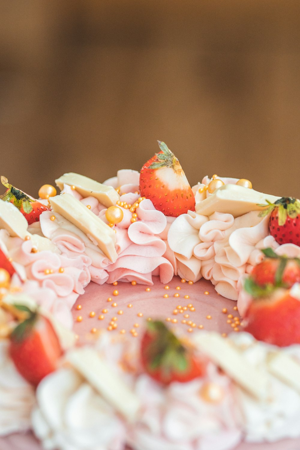 a close up of a cake with strawberries on it