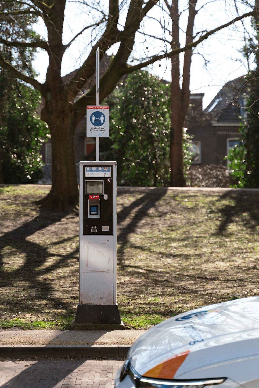 a parking meter on the side of the road