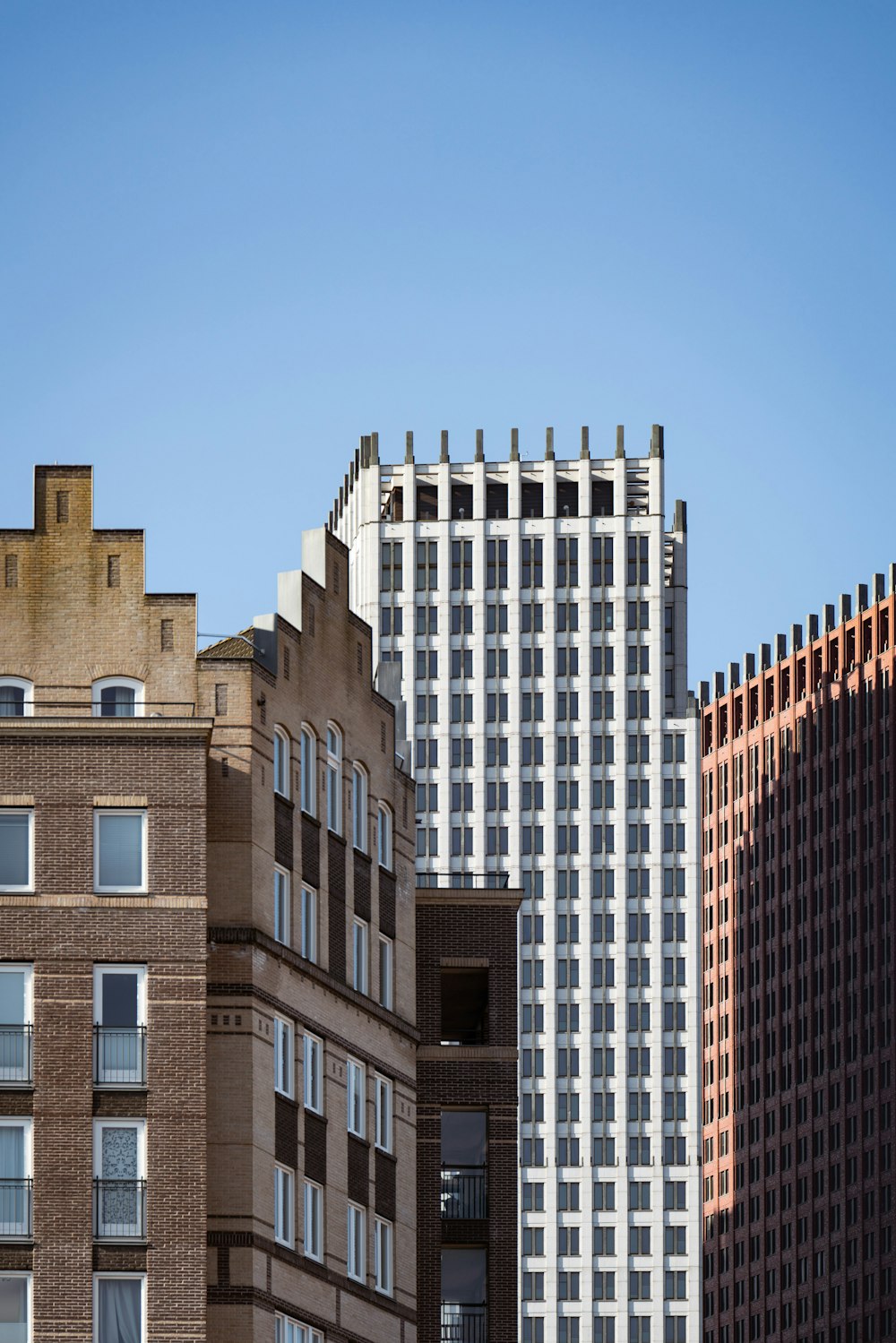 a group of tall buildings next to each other