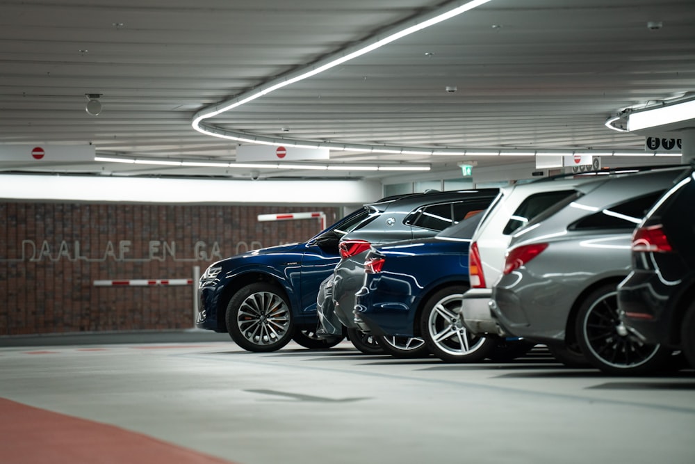 a row of parked cars in a parking garage