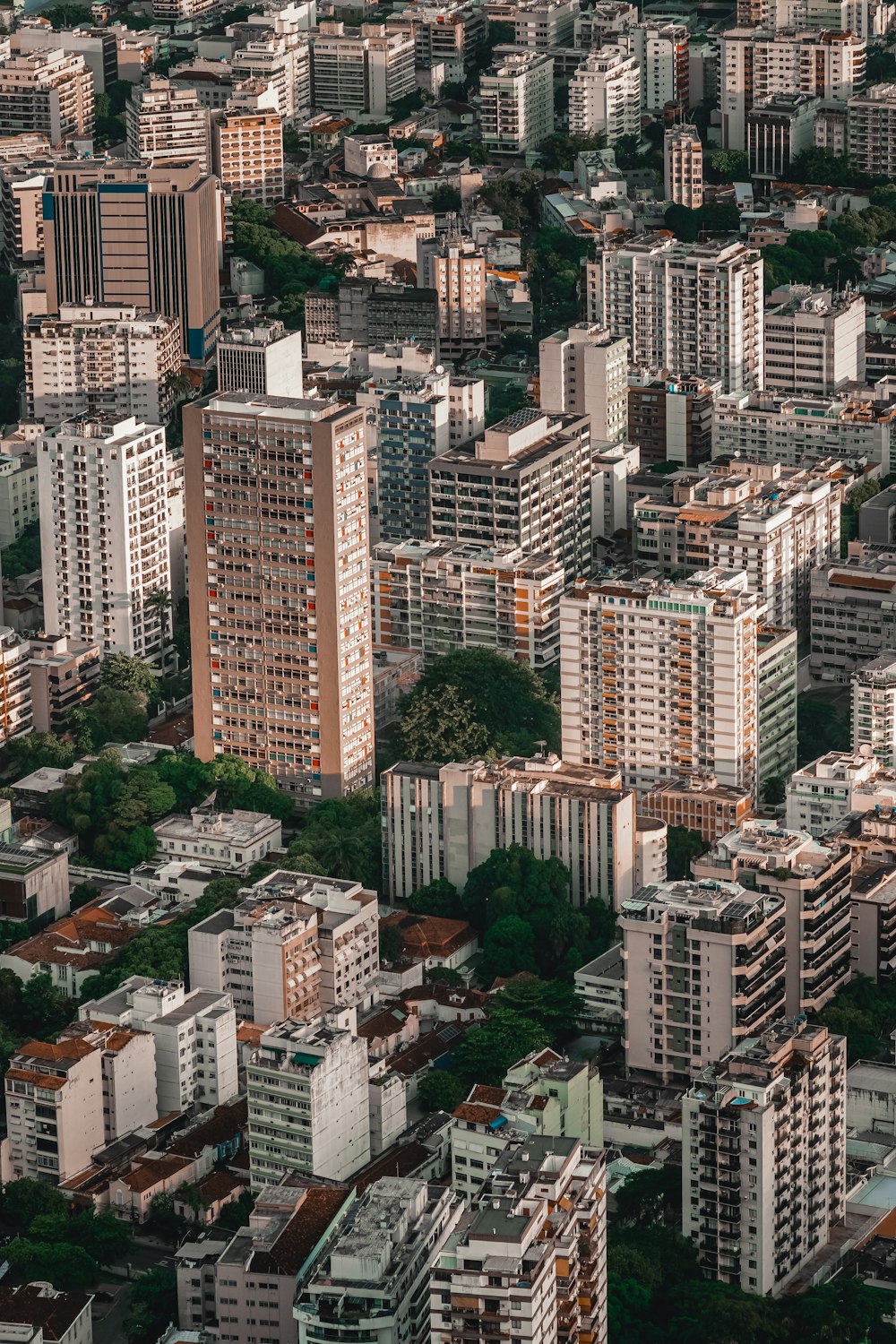 an aerial view of a city with tall buildings