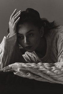 A cozy scene featuring a person wearing a soft pastel sweatshirt with a gentle mental health affirmation printed on it.