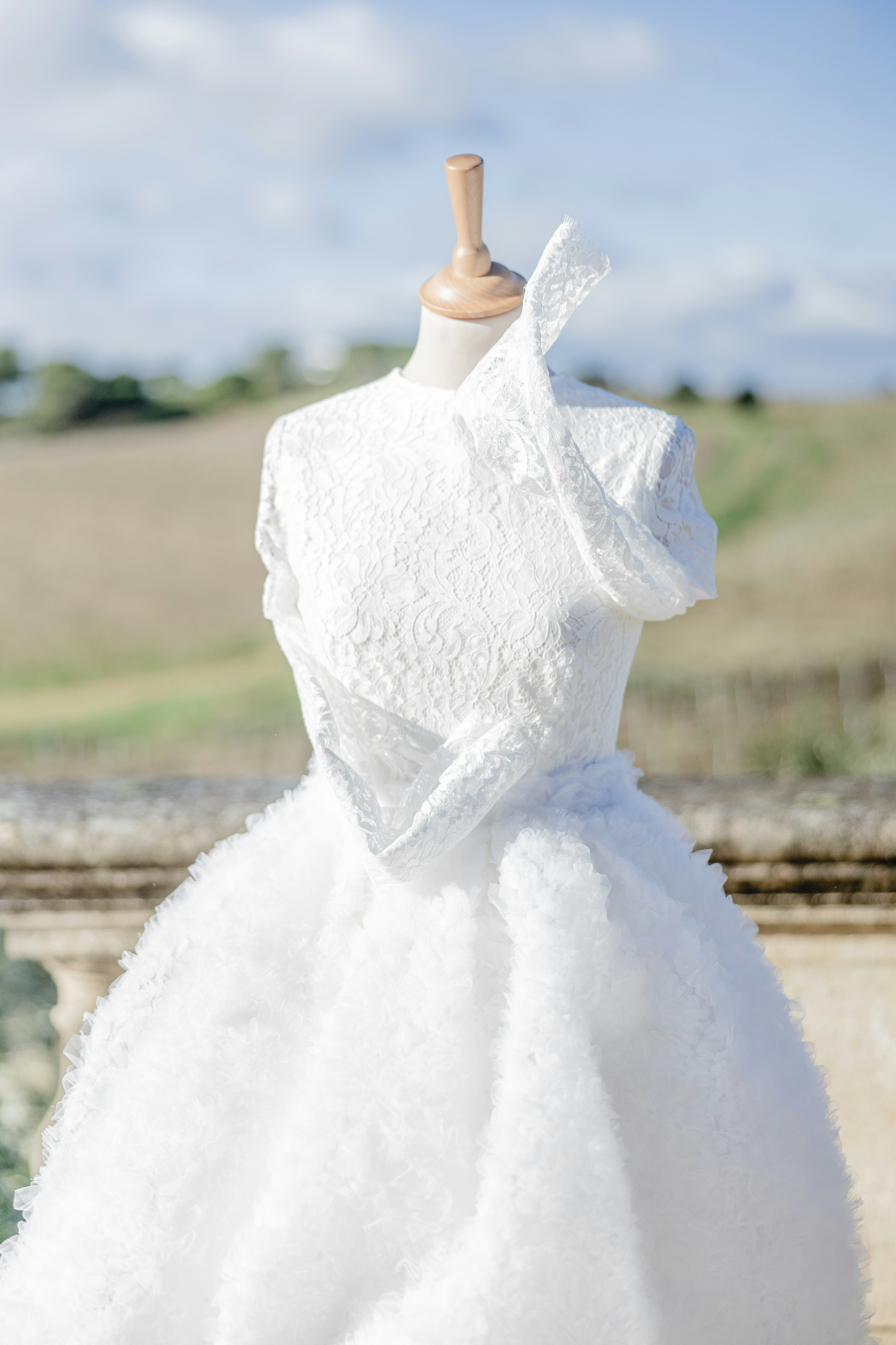 a white wedding dress on a mannequin