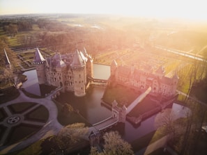 Balcony view capturing the medieval moat surrounding Spøttrup Castle.
