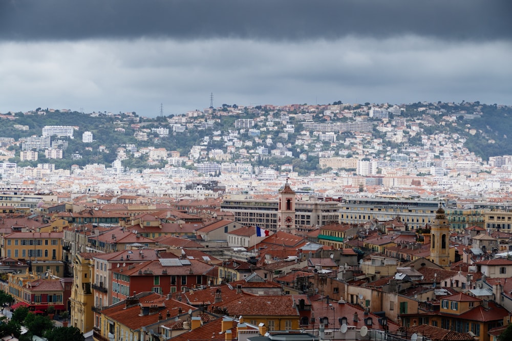 a view of a city with a hill in the background