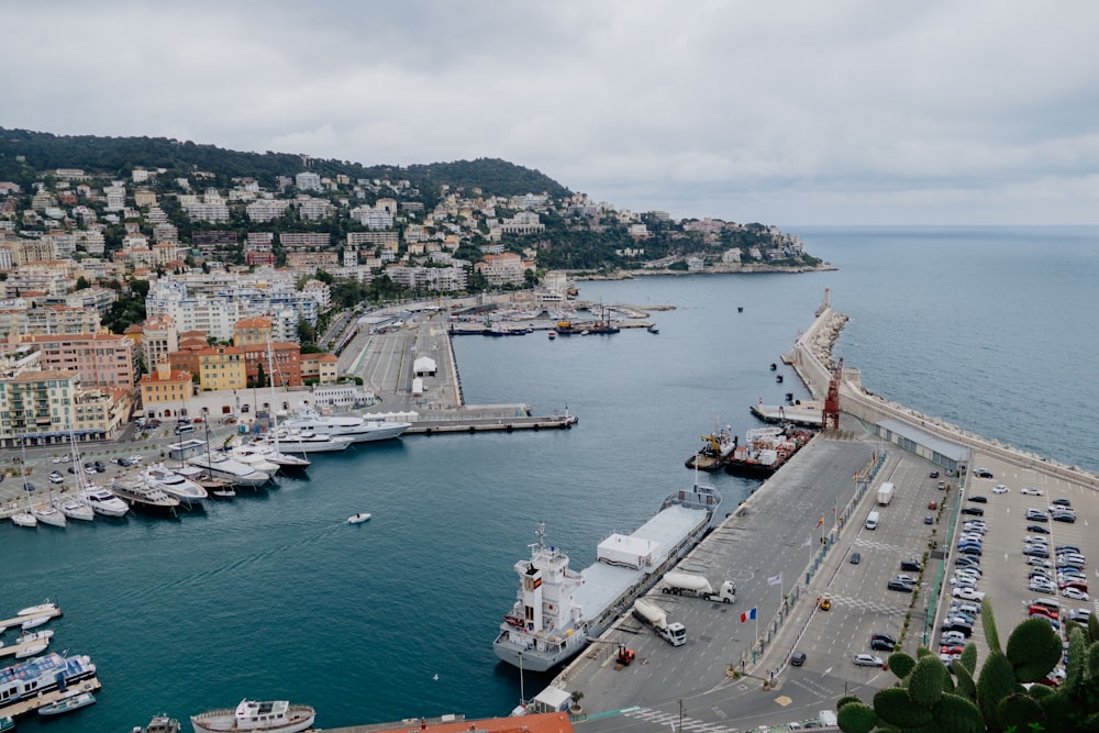 a harbor filled with lots of boats next to a city