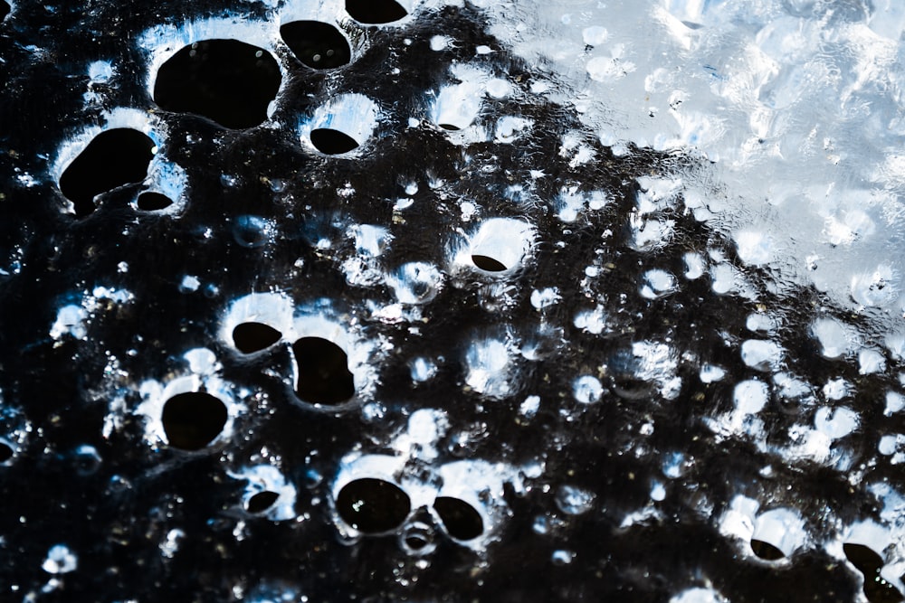 a close up of water bubbles on a surface