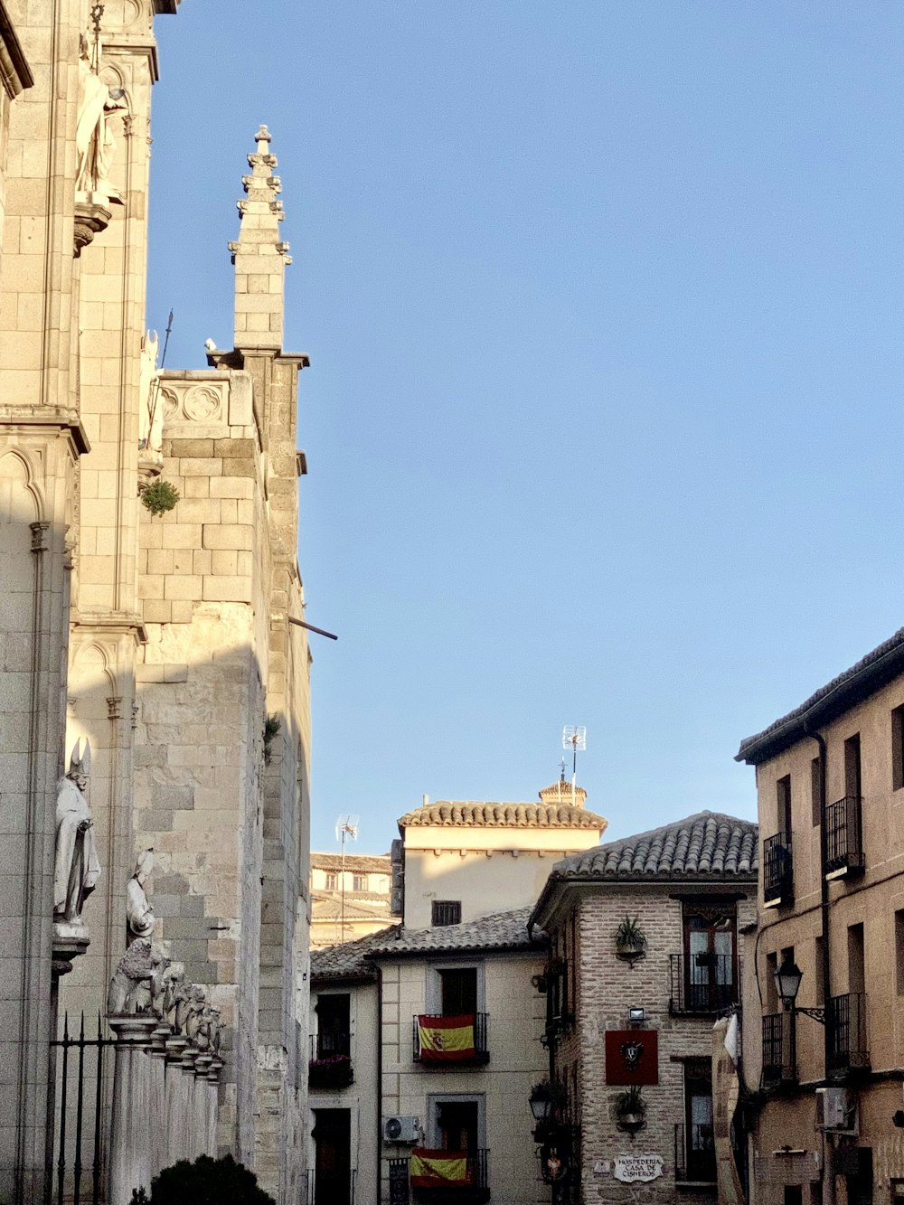 a city street with a clock tower in the background