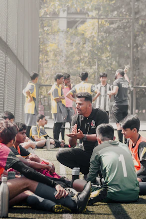 a group of people sitting on the ground
