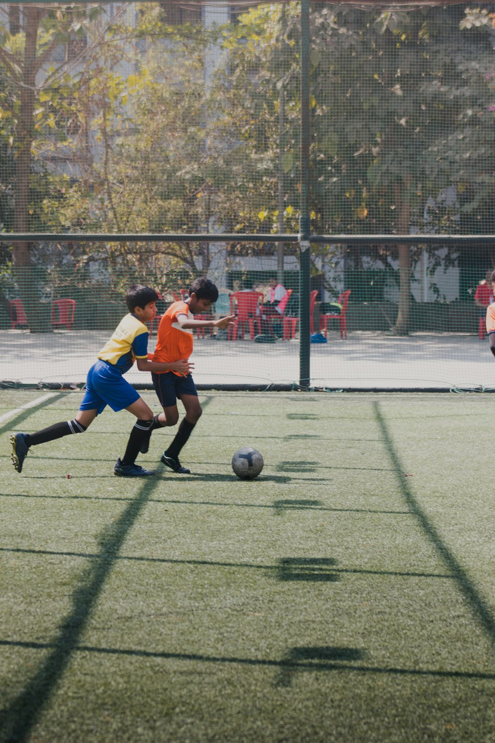 a group of young men playing a game of soccer