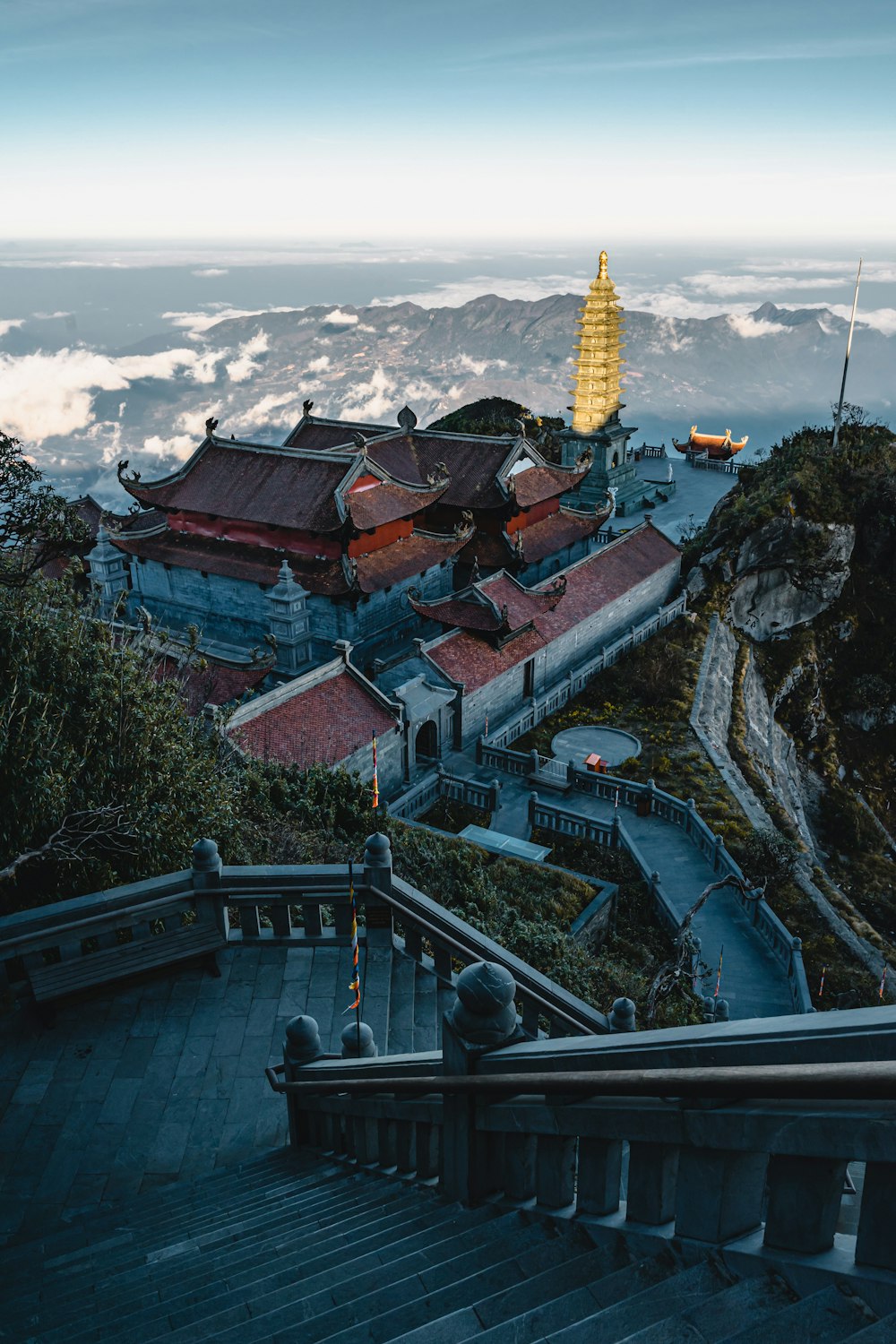 a stairway leading up to a building on top of a mountain