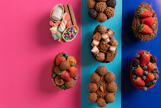 Golden wrapped gourmet Easter eggs arranged elegantly on a black background