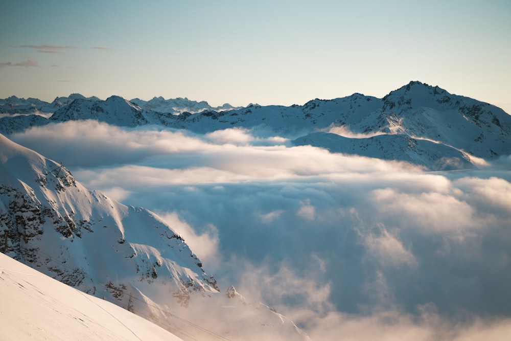 a view of a mountain covered in clouds