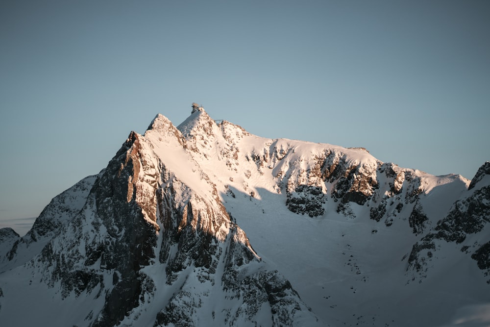 a snow covered mountain with a sky background