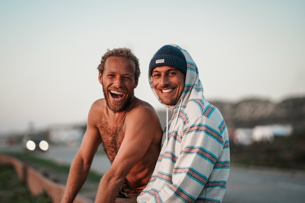 a couple of men standing next to each other