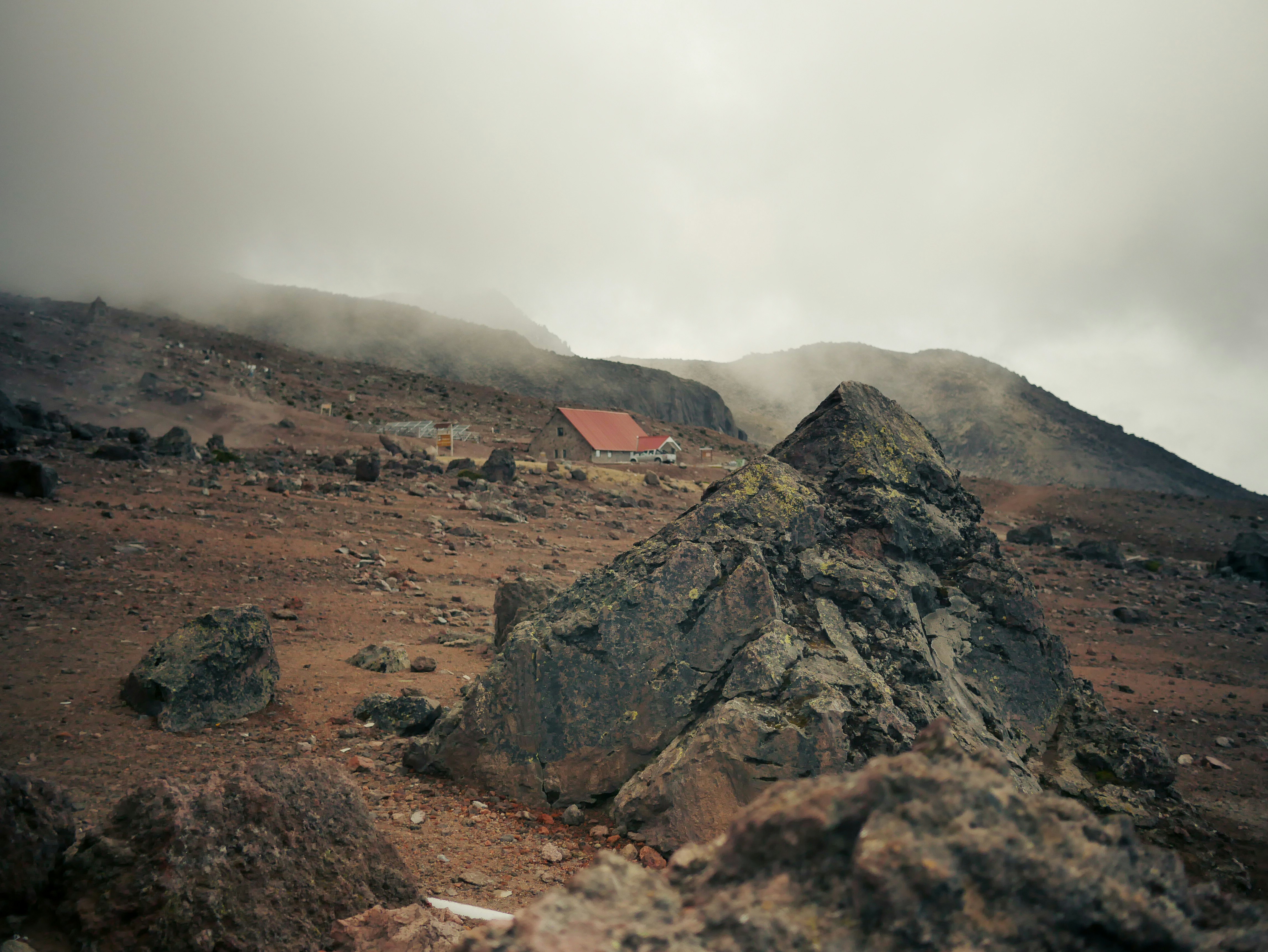 a mountain with a house on top of it