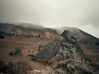 a mountain with a house on top of it