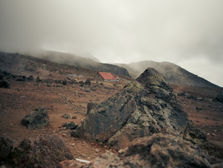 a mountain with a house on top of it