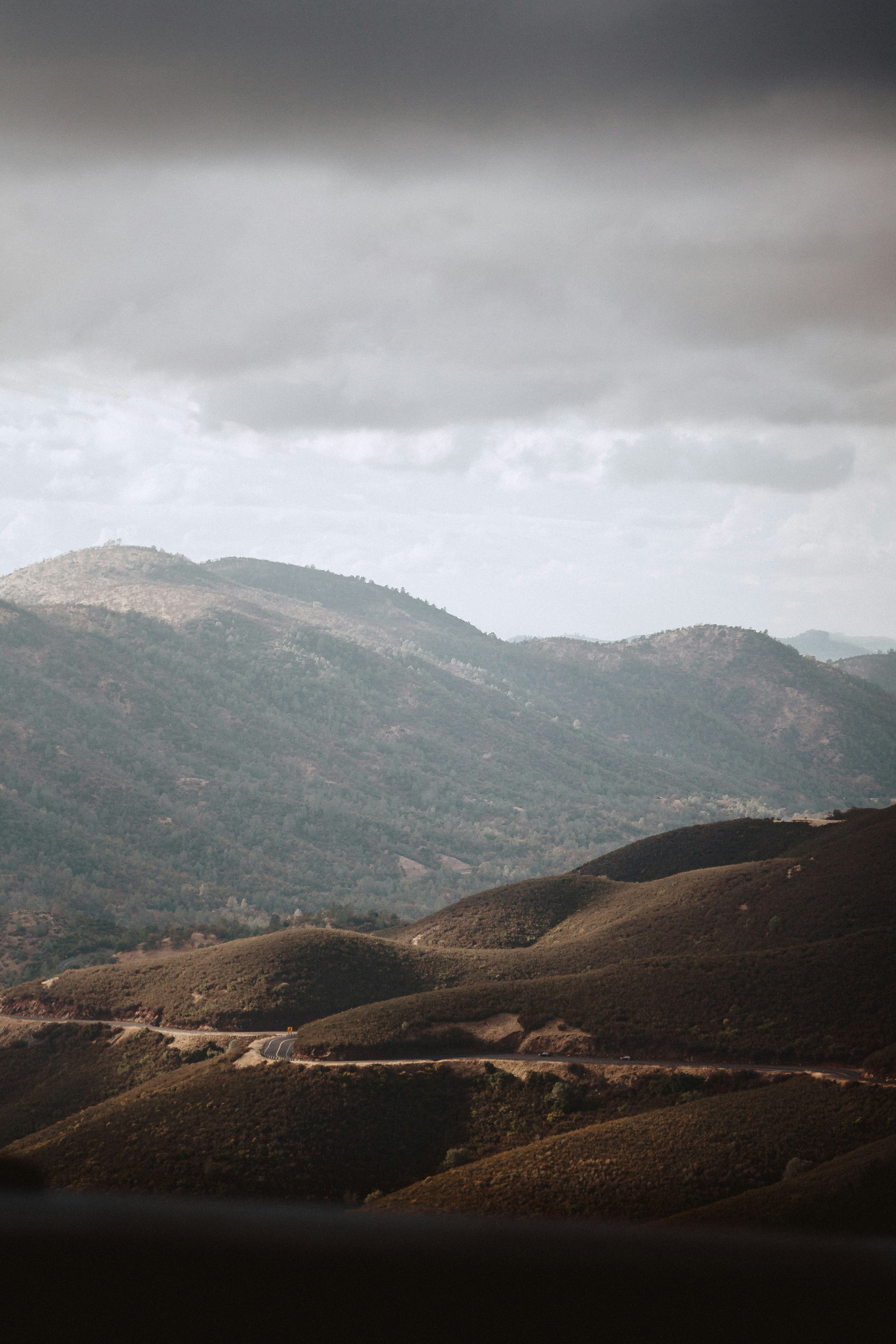 a view of a mountain range with a cloudy sky