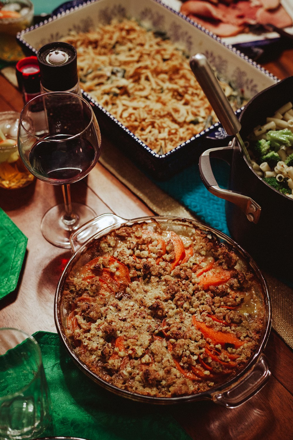 a table filled with dishes of food and wine