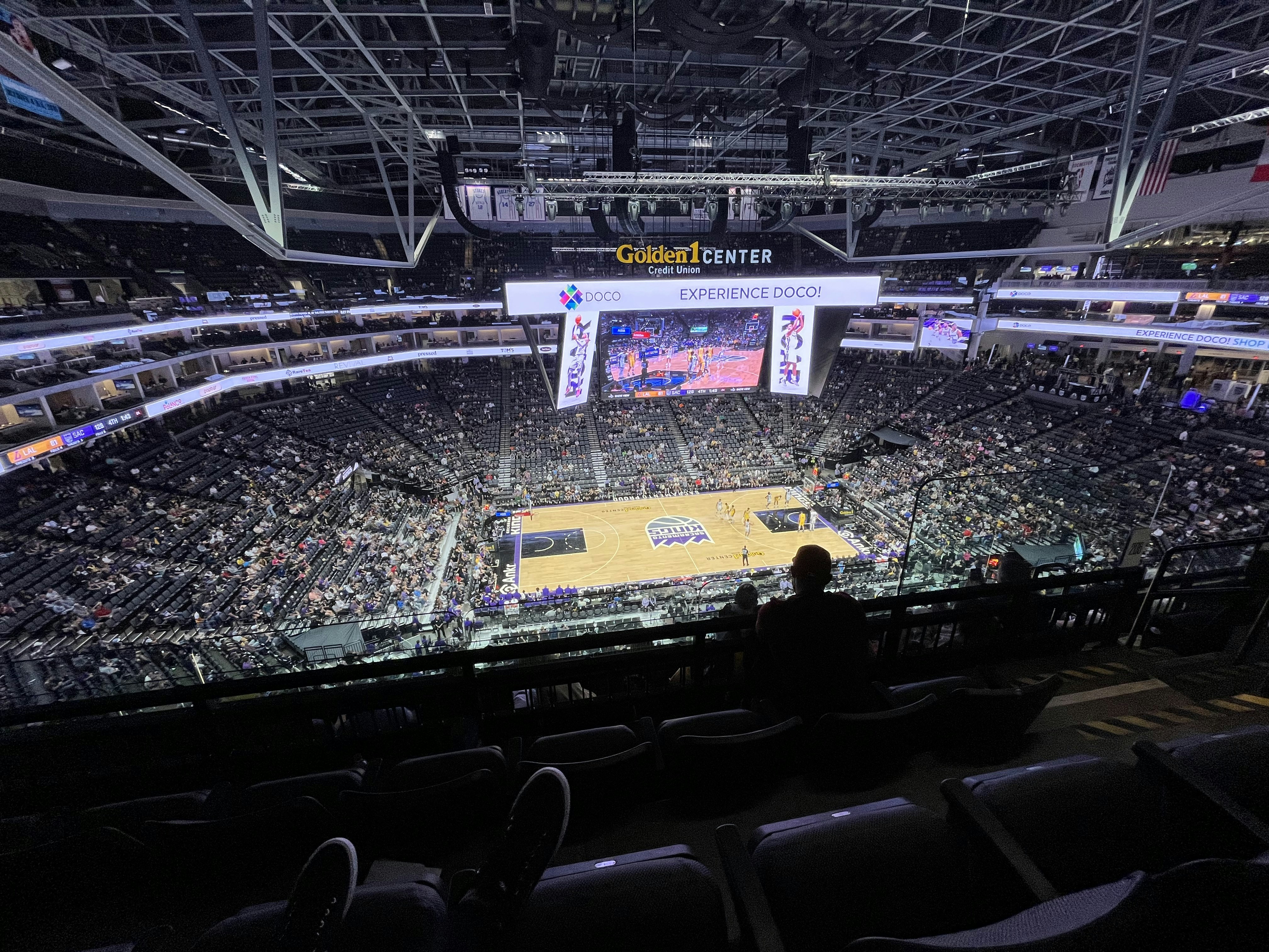 Basketball court aerial view during NBA game with packed arena