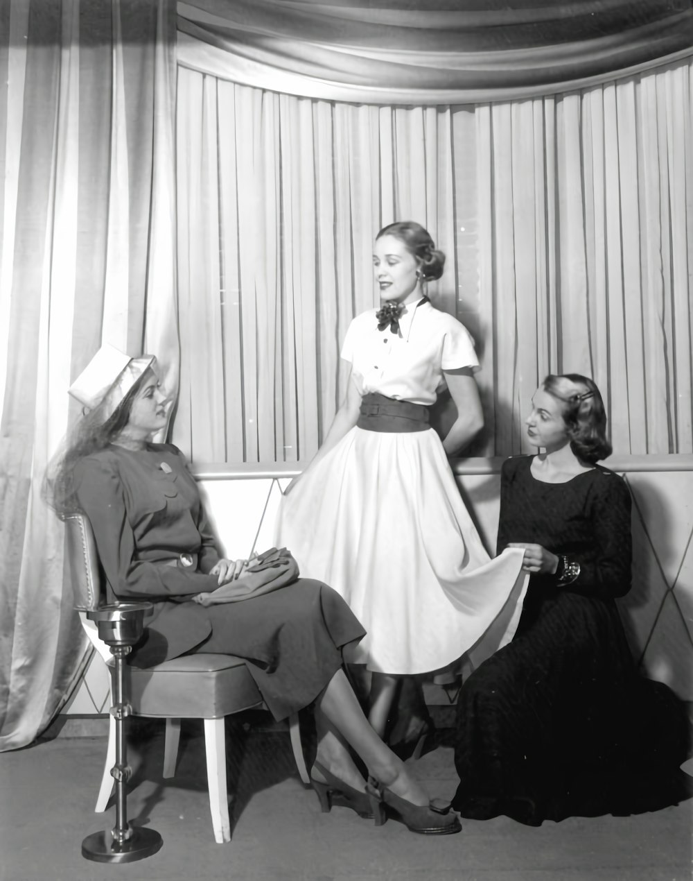 a group of women sitting next to each other