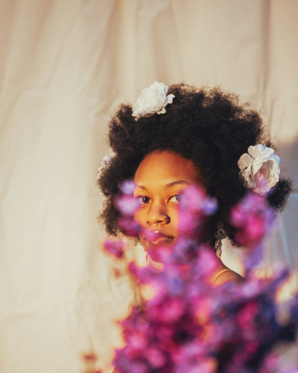 a young girl with a flower in her hair