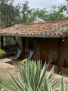 Exterior view of Miño House surrounded by gardens and trees