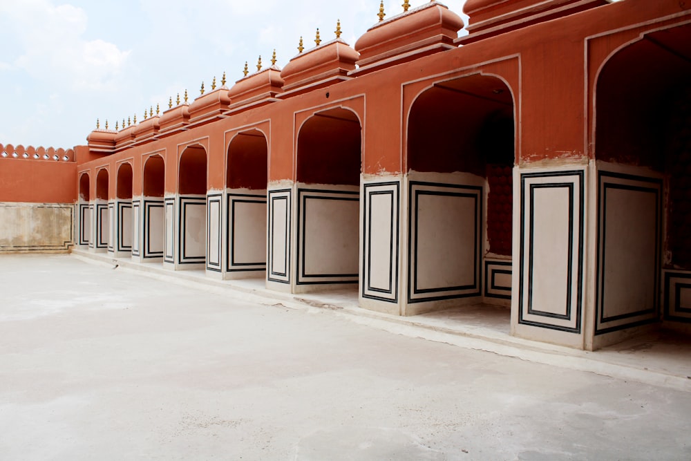 a row of red and white buildings with black trim