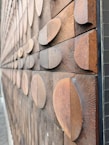 Close-up of textured wood wall panels in a stylish home setting.