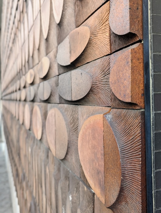Close-up of handcrafted rustic wooden wall art made from reclaimed wood with natural textures.