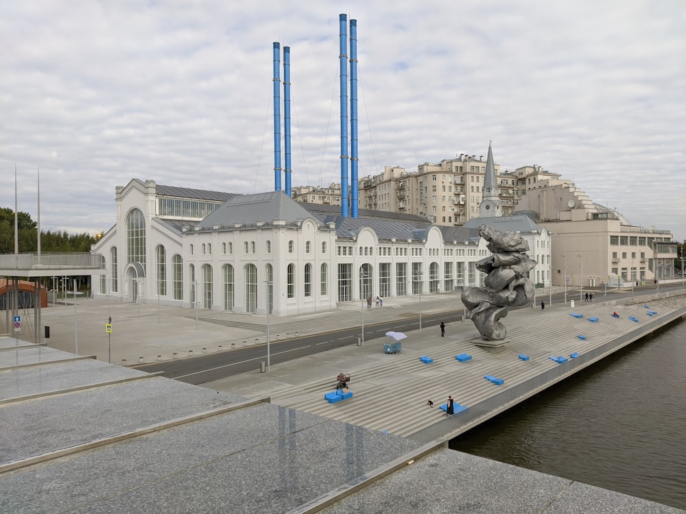 a large building with a statue in front of it