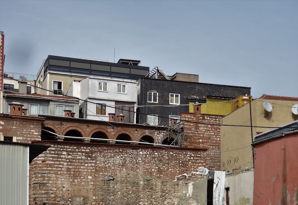 a brick building with a lot of windows on top of it